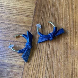 Gold hop earrings with navy leather bow